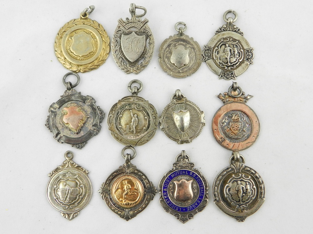 A collection of twelve various hallmarked silver fobs