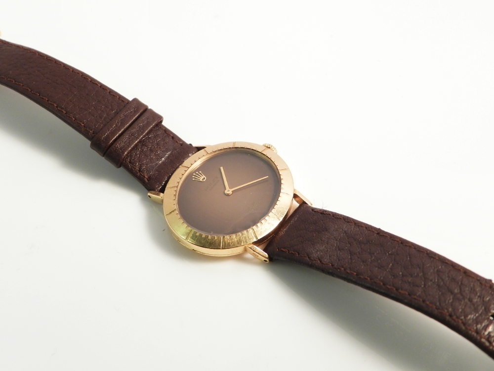 A Rolex 18ct gold cased gentleman`s wristwatch on a tan leather strap.