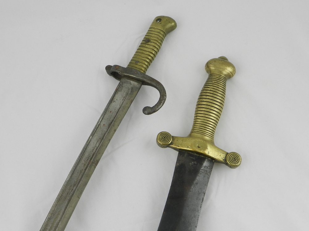 A French bayonet together with a gunners short sword.