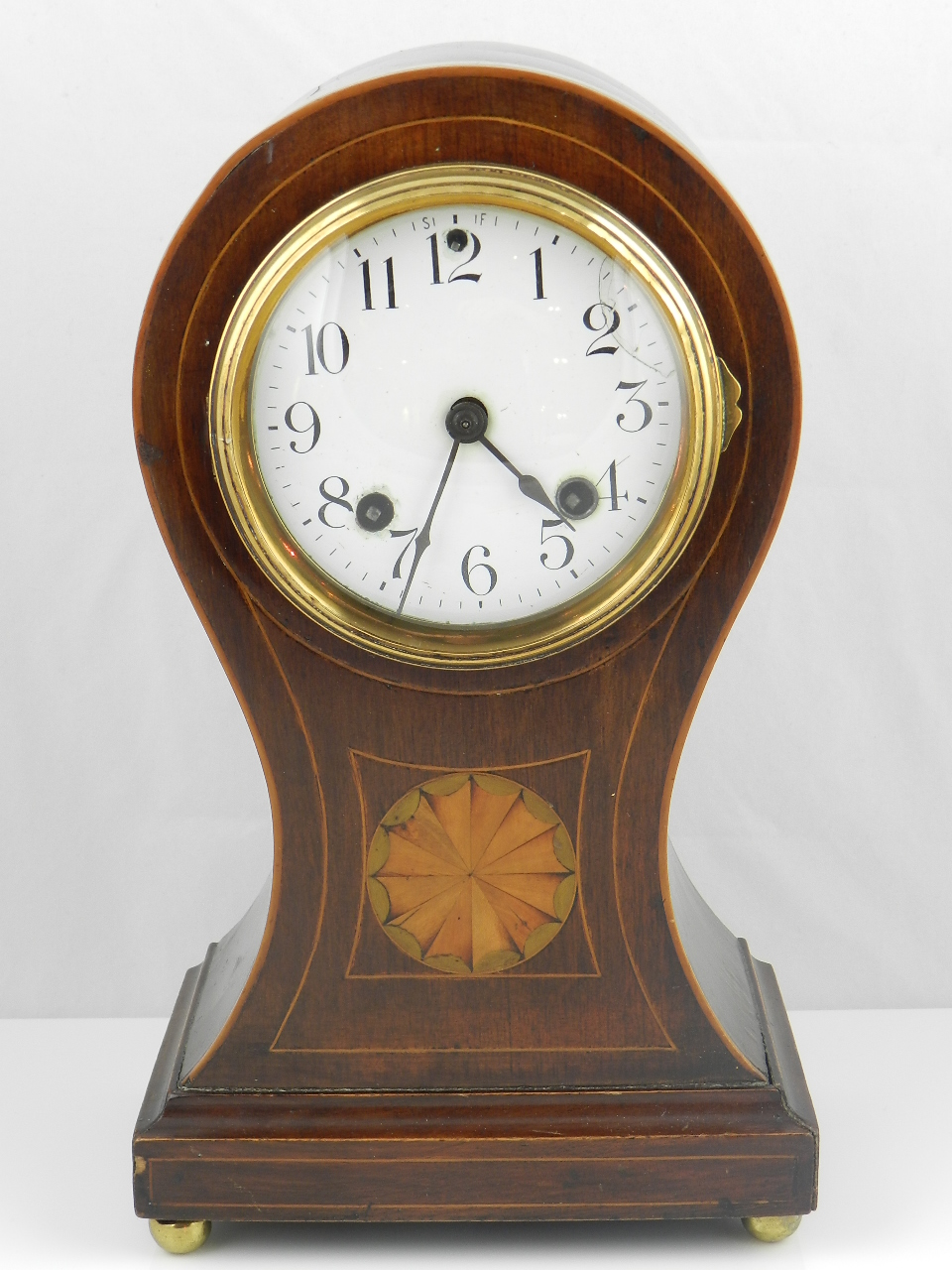 A large Edwardian balloon shape mantle clock, twin train chiming hours and half hours. Inlaid with