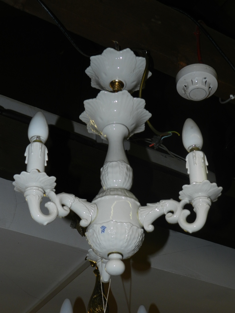 A contemporary white porcelain chandelier in the eighteenth century style.