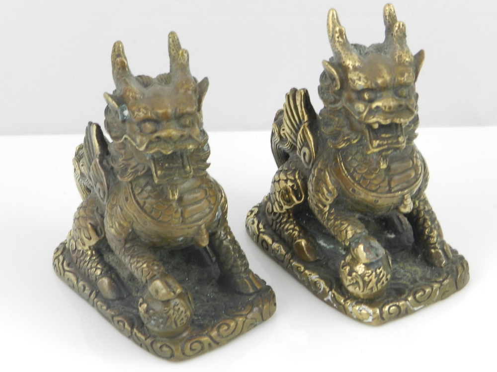 A pair of Chinese bronze models of kylins