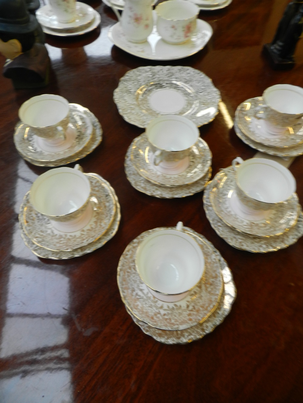 A gold and white Colclough china tea service.
