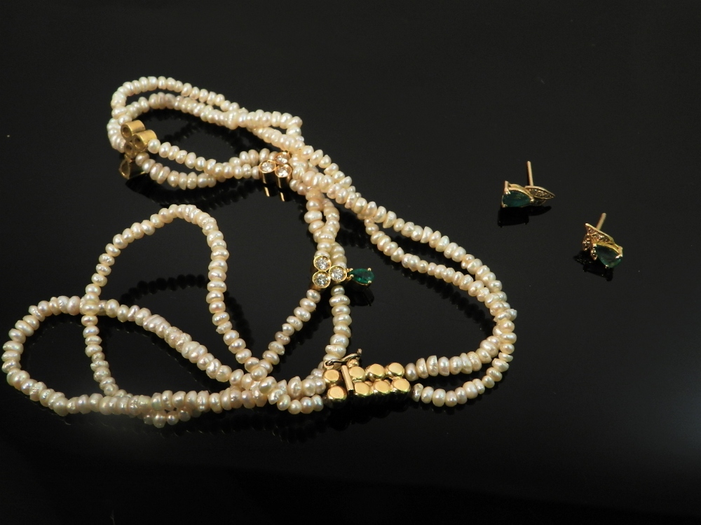 A five strand pearl necklace finished with an 18ct gold clasp.