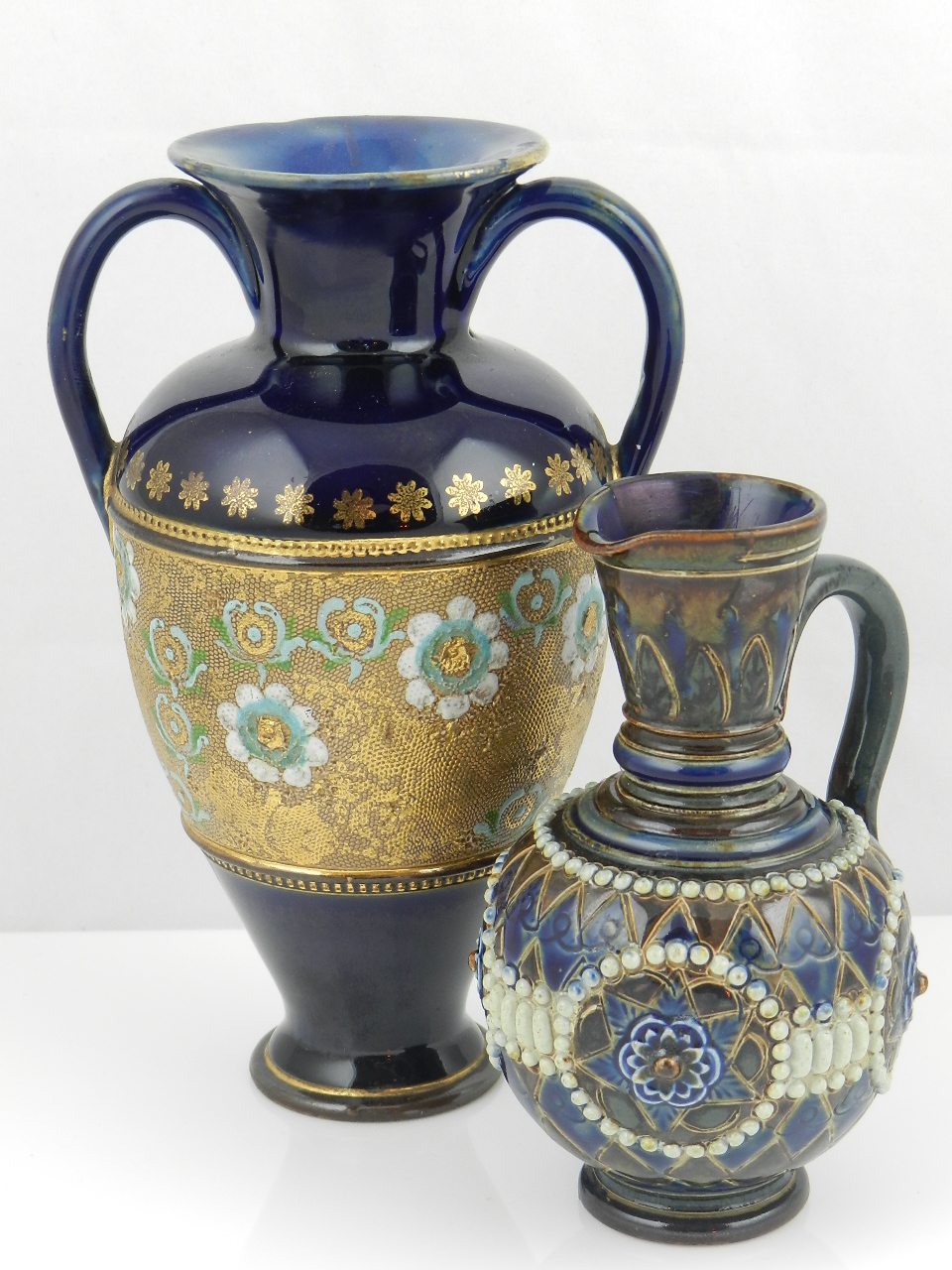 A Royal Doulton twin handled vase and one other water jug. (A/F)