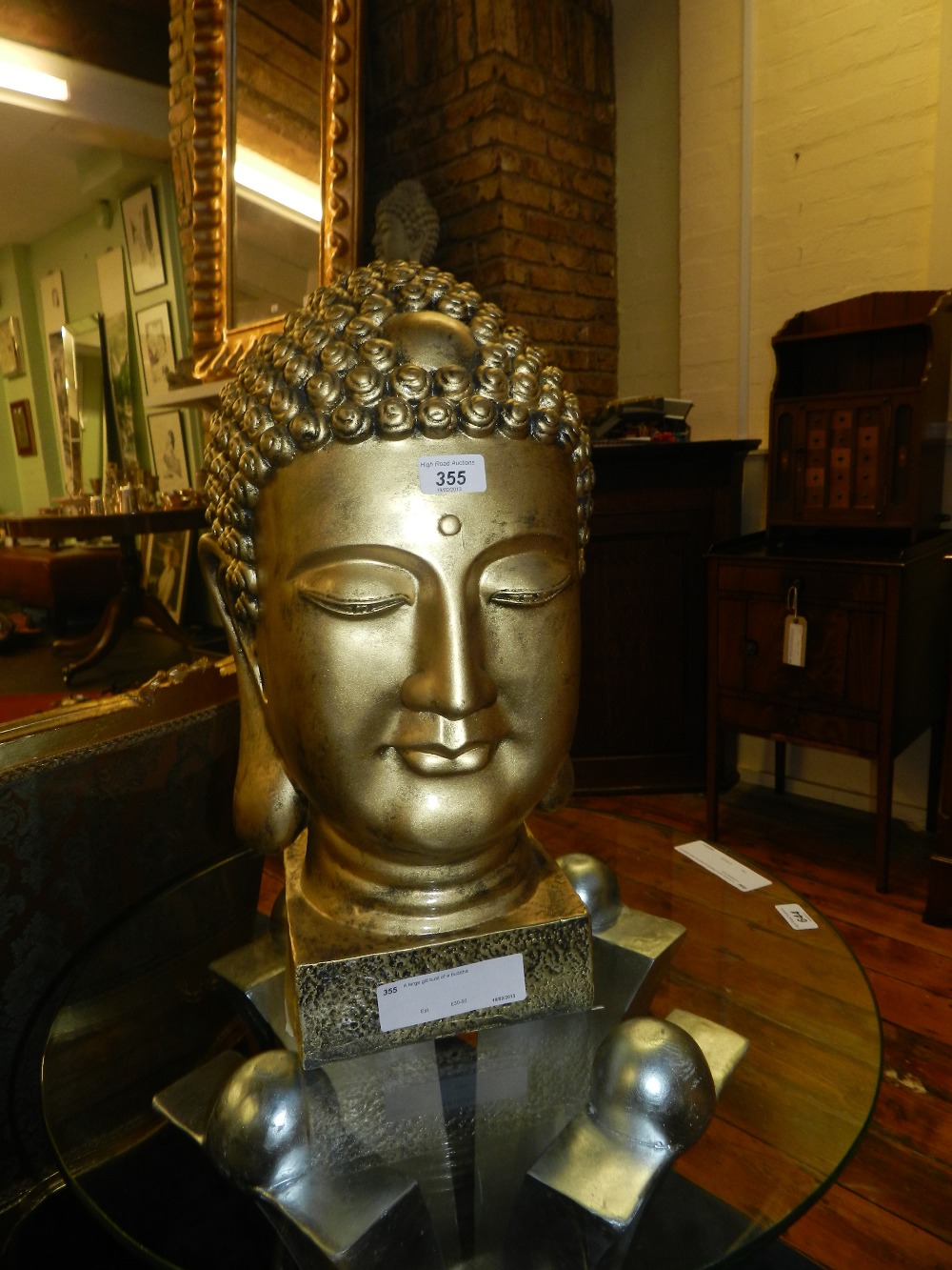 A large gilt bust of a buddha