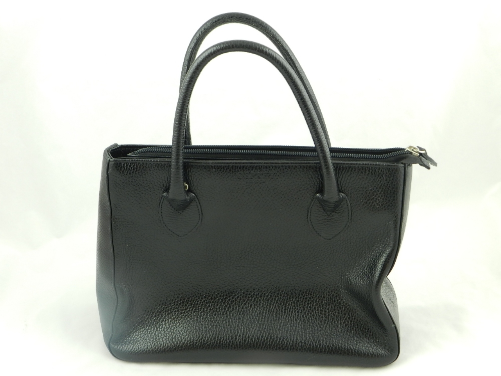 A black leather Osprey handbag with fitted interior as new