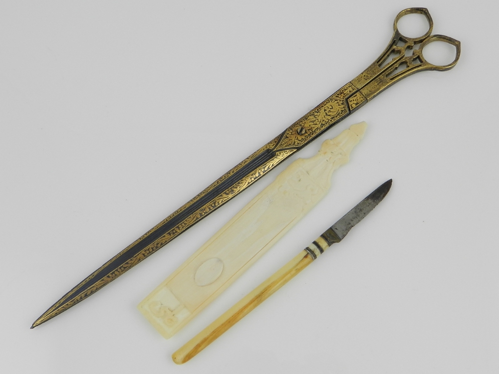 Three Ottoman calligraphy tools to include damascene metal work scissors, an ivory pen rest and an