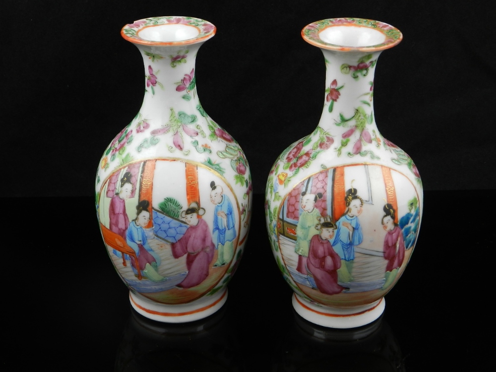 A similar pair of Chinese mid 19th century baluster shape vases of famille rose palette decorated