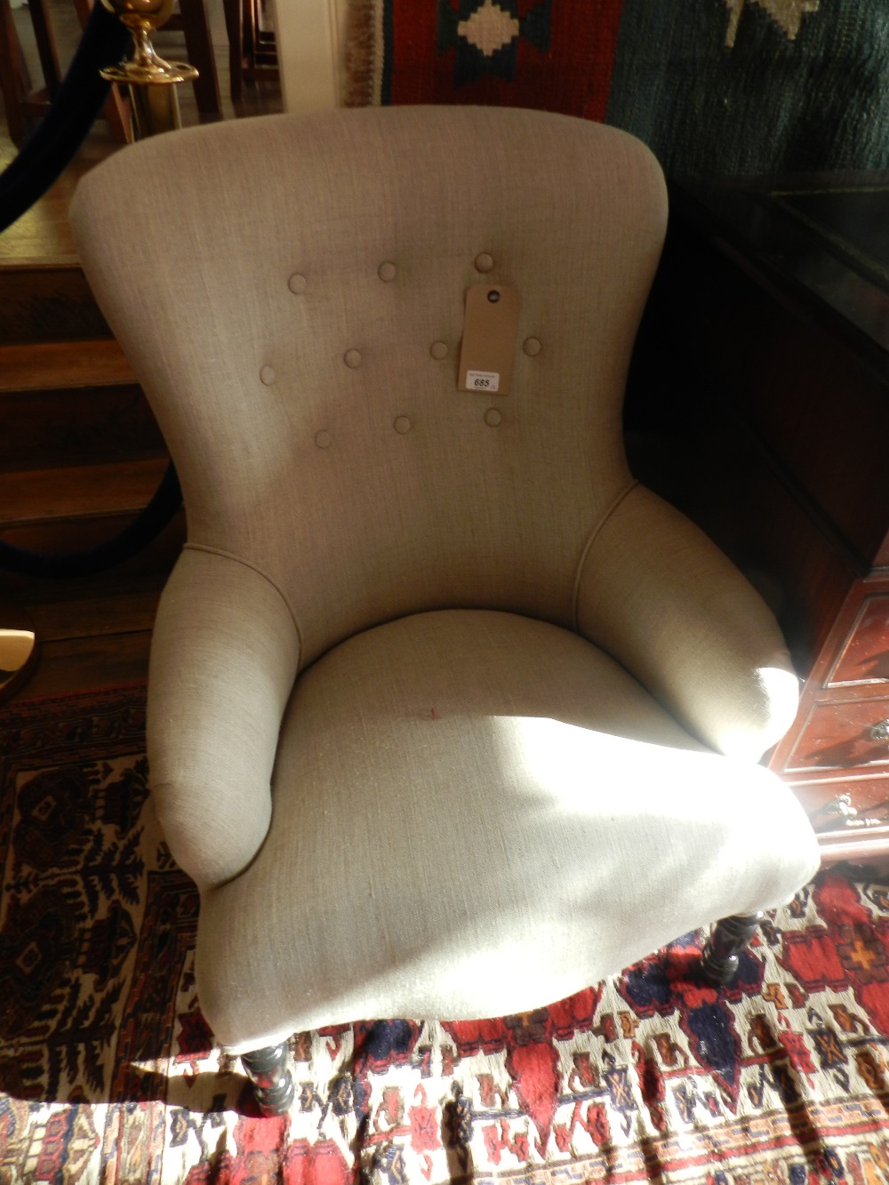 A pair of vintage framed library armchairs, newly button back upholstered in a stone linen fabric