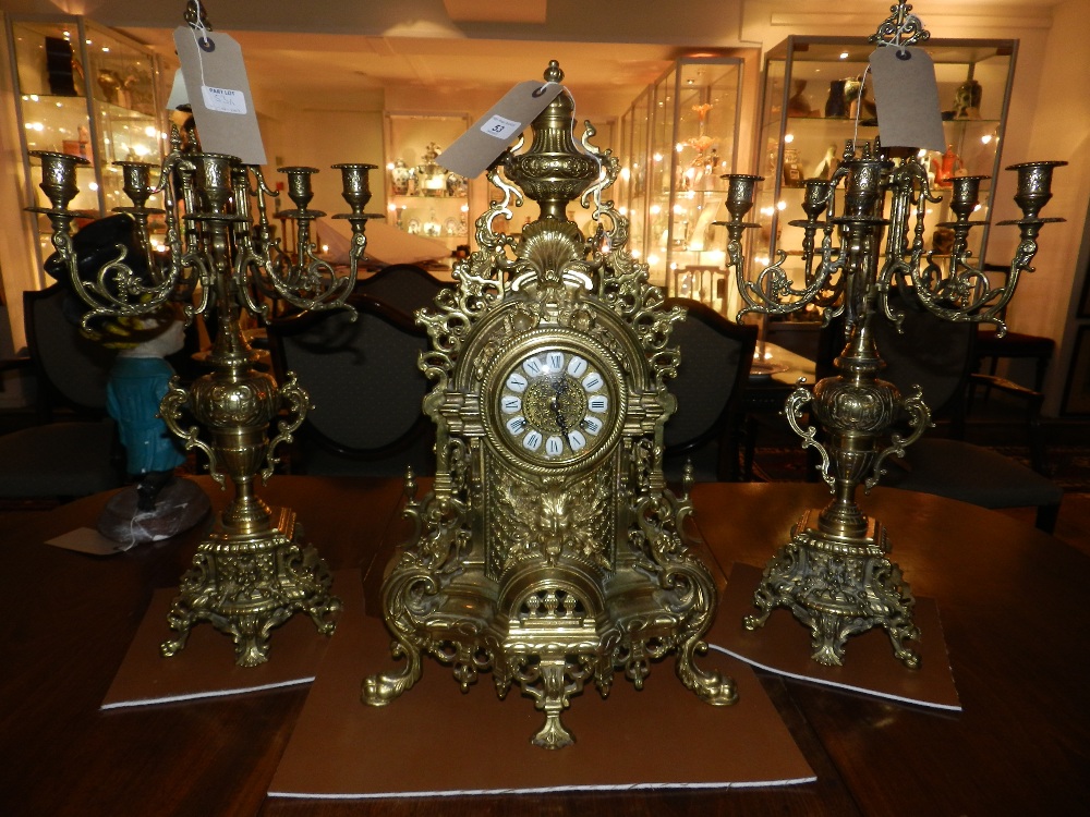 A large brass Chiming clock with eight day Franz Hermle movement, complete with twin five branch