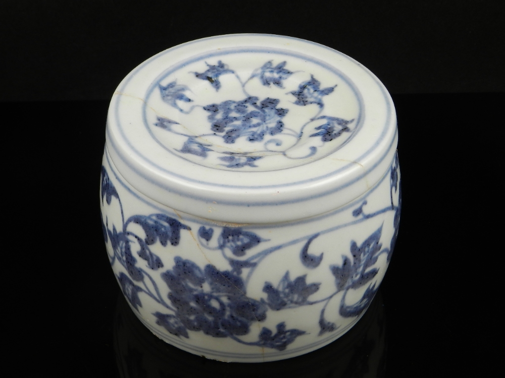 A Chinese "Ming" cylindrical blue and white pot and cover with character marks on the base (A/F)