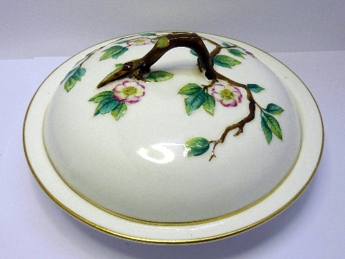 A Royal Worcester muffin dish decorated with flowering branches, staple repair to lid