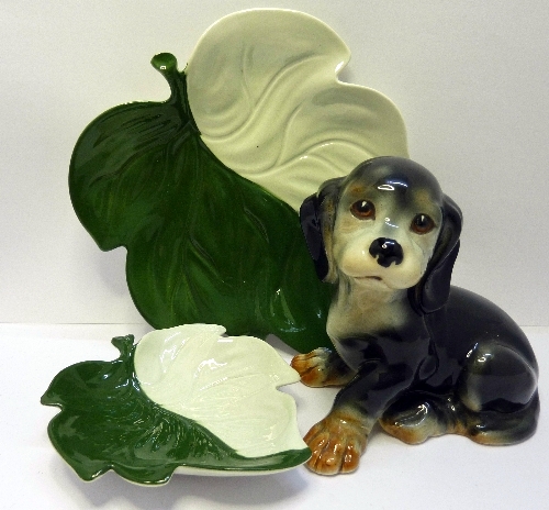 A Sylvac dog, model number 3320, height 11cms and two Carlton ware leaf dishes