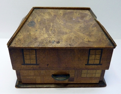 A novelty wooden trinket box in the form of a house