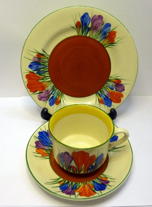 A Newport Pottery Clarice Cliff Bizarre crocus patterned trio, a/f