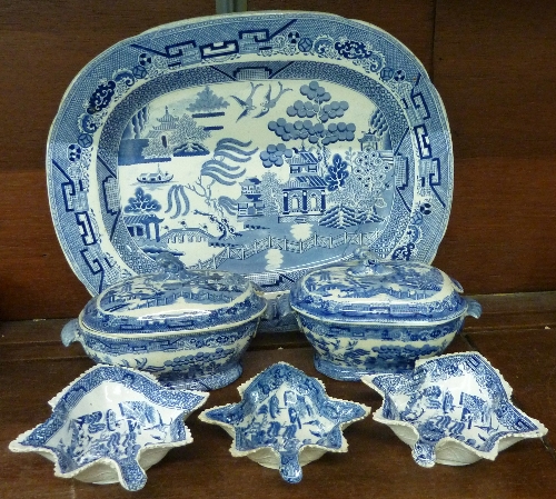 Two blue and white Willow pattern tureens and three similar graduated pickle dishes in the form of