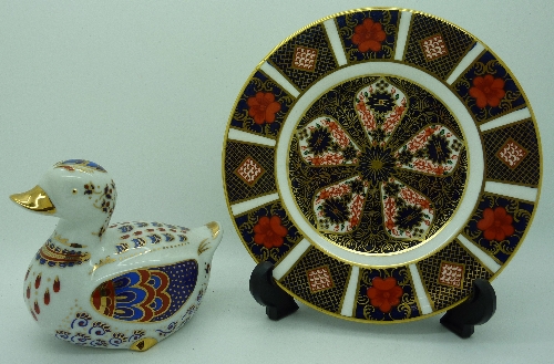 A Royal Crown Derby Imari pattern tea plate, second and a china paperweight in the form of a duck