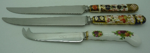 Two Royal Crown Derby Imari patterned knives and a Royal Albert Old Country Roses pattern cheese