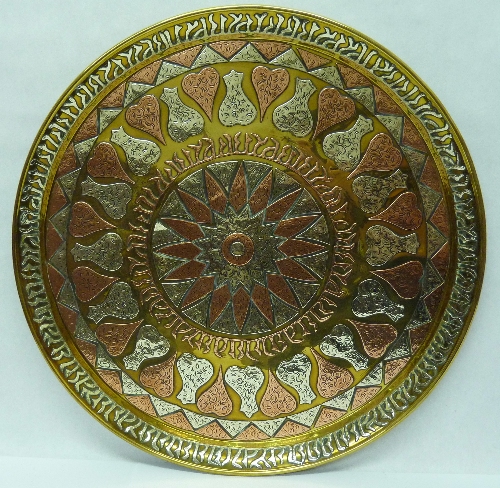 A large Algerian brass copper and white metal circular charger, diameter 49cms, a/f