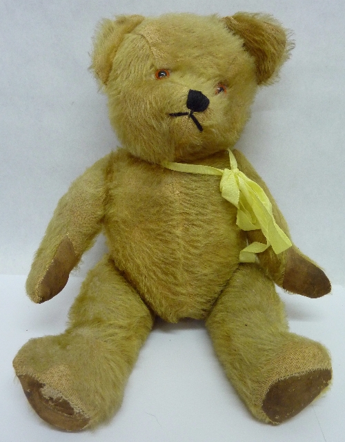A jointed Teddy bear with growler, height 37cms