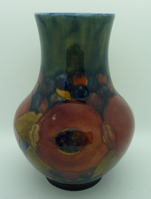 A Moorcroft vase decorated in the Pomegranate pattern, height 17cms, a/f