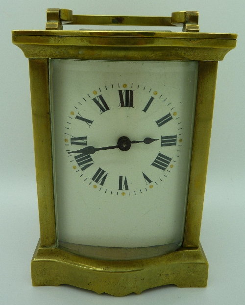 A French brass cased carriage timepiece, height with handle raised 14cms