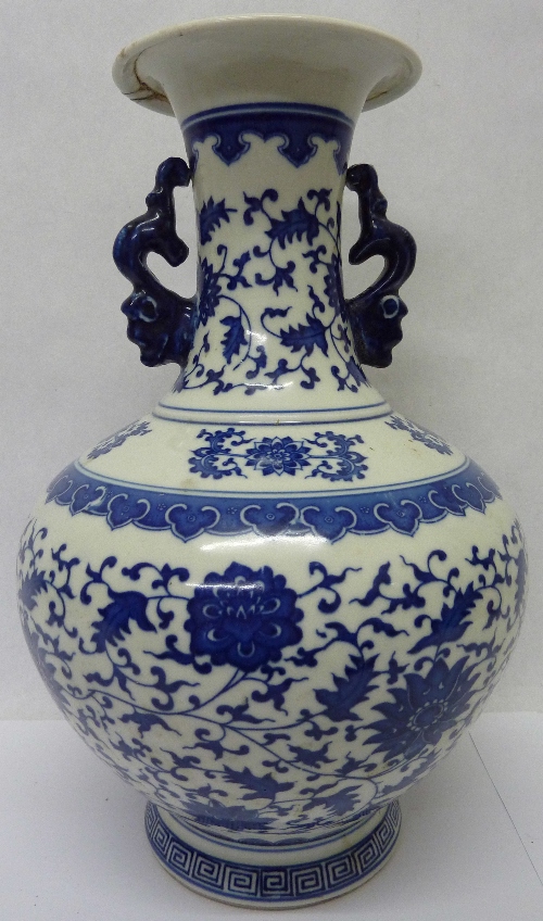 An oriental blue and white vase, a/f, height 33cms