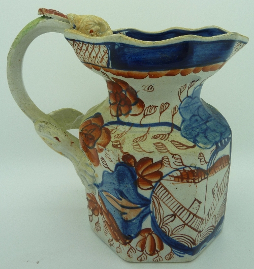 A 19th Century ironstone jug with serpent handle, height 15.5cms, a/f