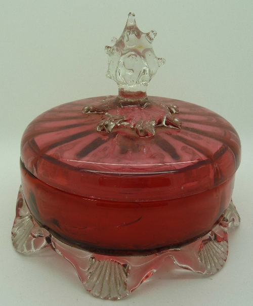 A cranberry glass lidded bowl, a/f, height 12cms