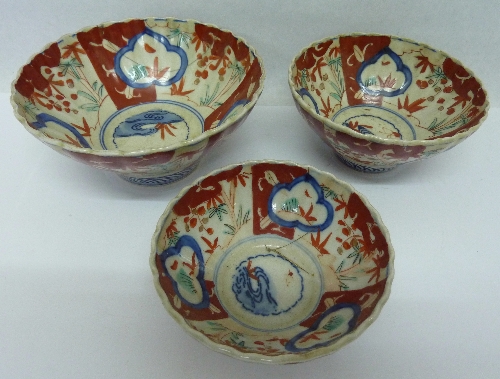 Three graduated Imari bowls, height of tallest 7cms