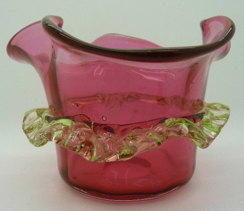 A cranberry glass dish, height 8.5cms