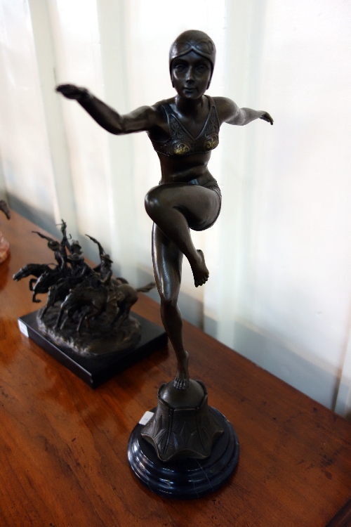 A reproduction Art Deco style bronze figure of a female dancer in the manner of Ferdinand Preiss