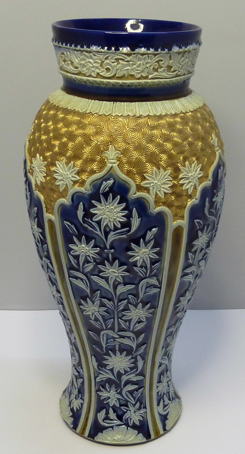 A Doulton Lambeth stoneware vase with raised floral decoration, height 28cms