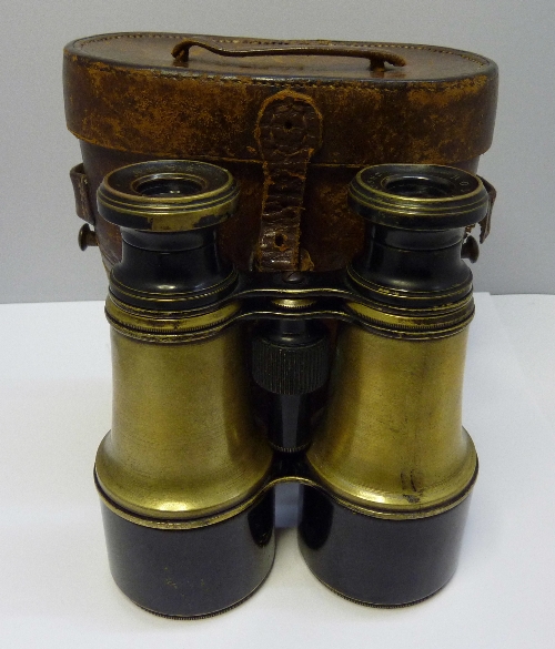 A pair of Ross field binoculars in a leather Ross case