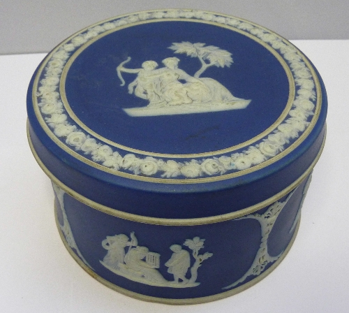 A 19th Century Wedgwood blue Jasperware circular box with cover decorated with classical figures,