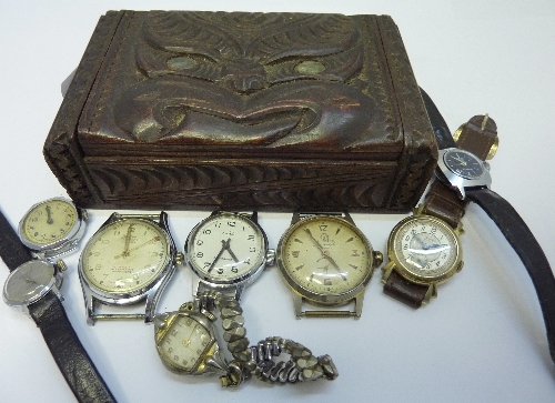 Four wristwatch heads, four lady`s wristwatches and a carved wooden box