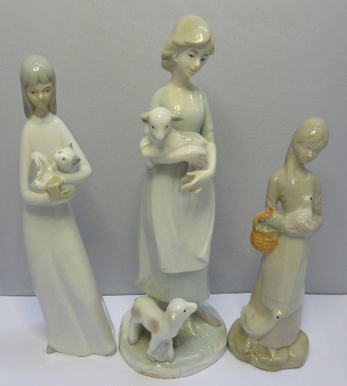 A Miguel figure of a girl with cat, height 24cms and two other figures