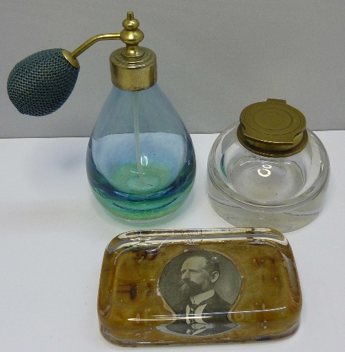 A scent bottle, a glass inkwell and a glass paperweight