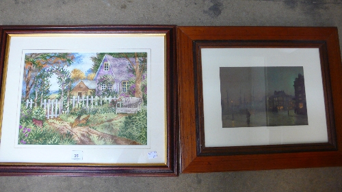 A needlework picture of a cottage and a print, both framed