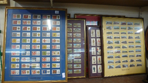 Six sets of cigarette cards, framed