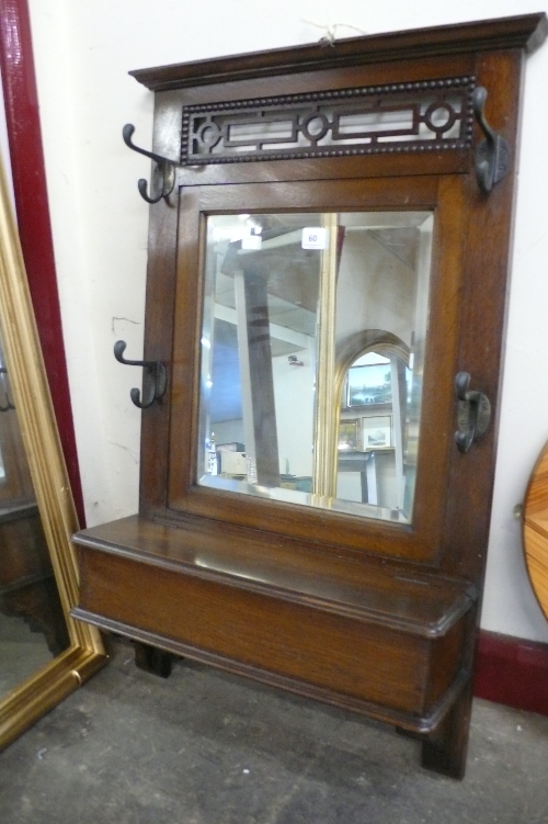 An oak and mirrored hall rack