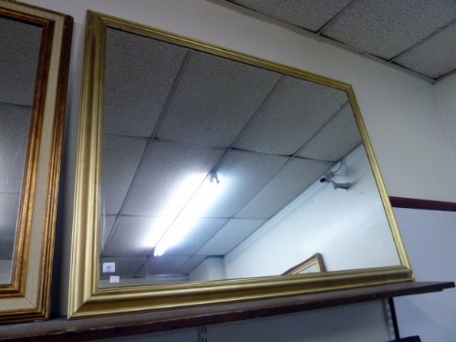 A gilt framed mirror