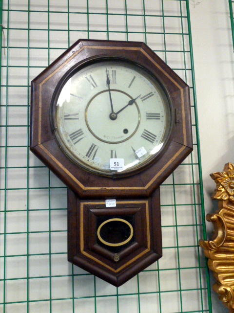 A mahogany wall clock by Seth Thomas