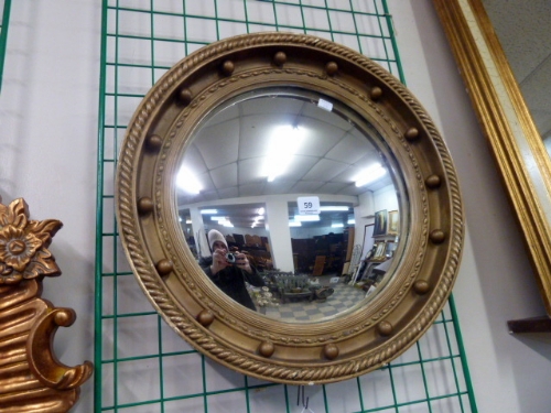 A reproduction Regency style gilt framed convex mirror