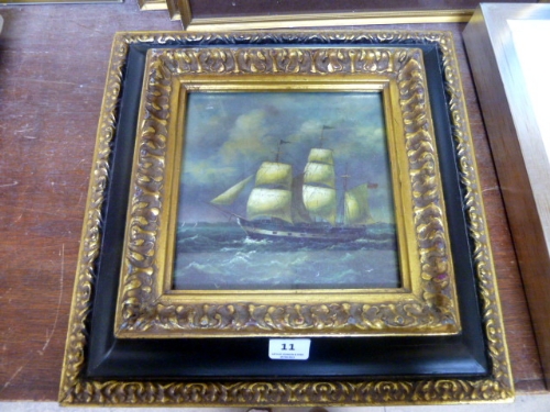 A reproduction print of a boat, framed