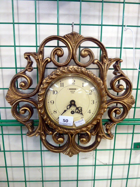 A Smith`s eight-day gilt wall clock
