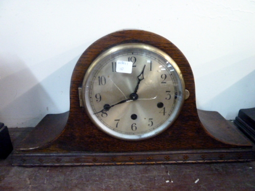 An oak mantel clock