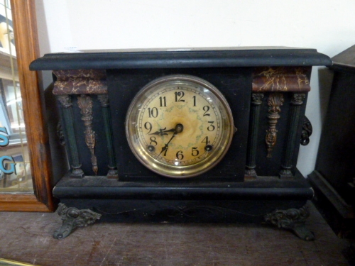 A 19th century faux marble mantel clock