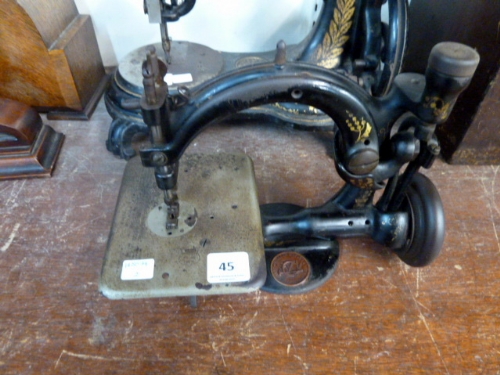 A Victorian Willcox & Gibbs sewing machine